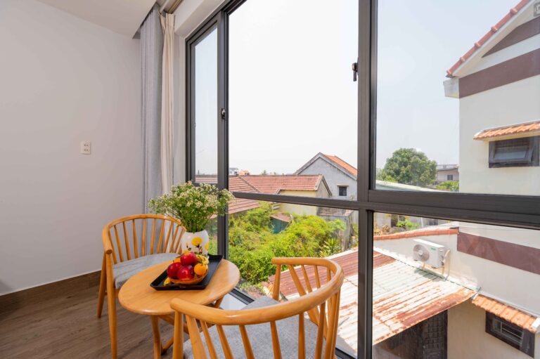 Luxurious deluxe room overlooking Hoi An rice fields with freestanding bathtub